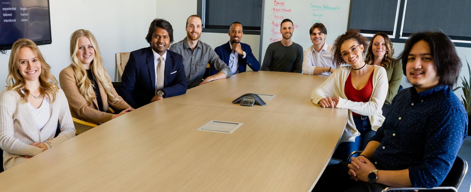 Leadership team aligning around a boardroom table to close stalled decisions