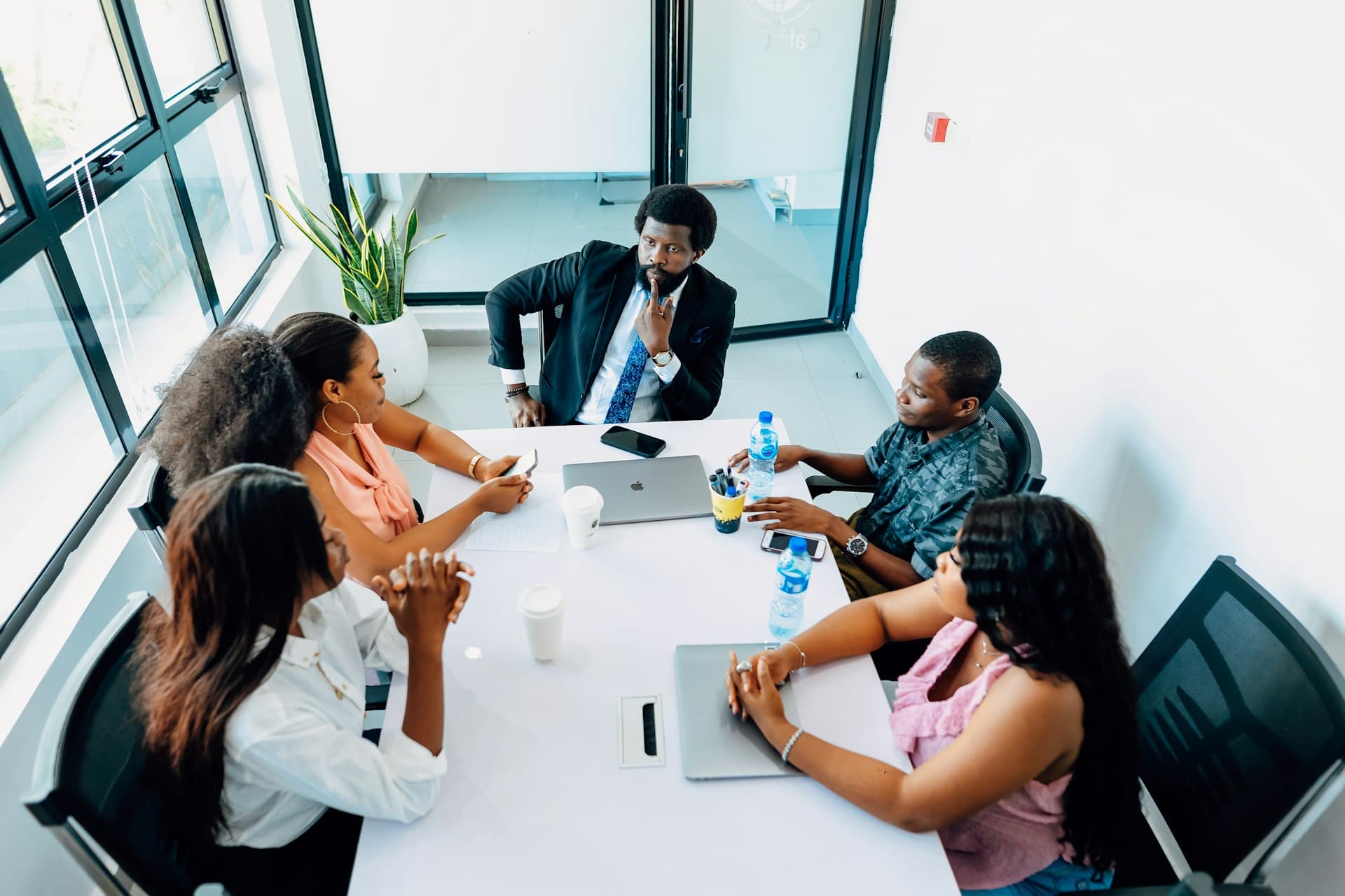 Newly merged teams collaborating to unify onto one platform after acquisition